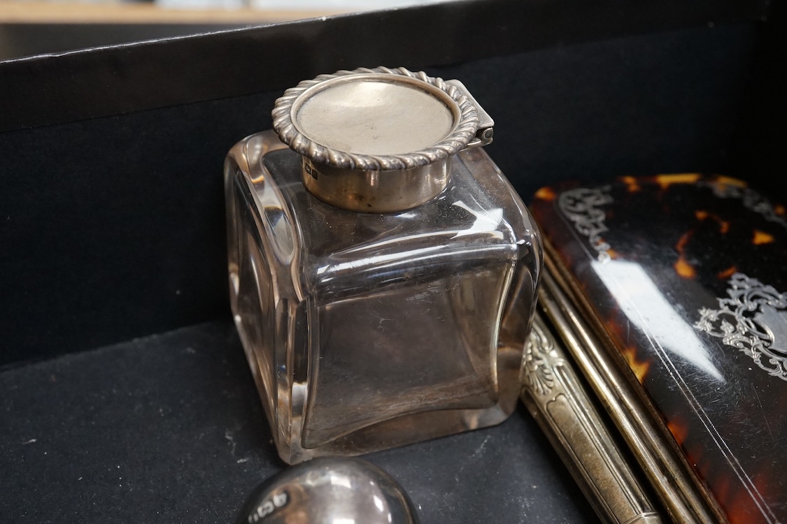 A late Victorian silver mounted glass hip flask, James Dixon & Sons, Sheffield, 1891, 15.5cm (lead solder), together with a silver mounted glass inkwell, assorted silver handled plated dessert eaters(a.f.) and a tortoise